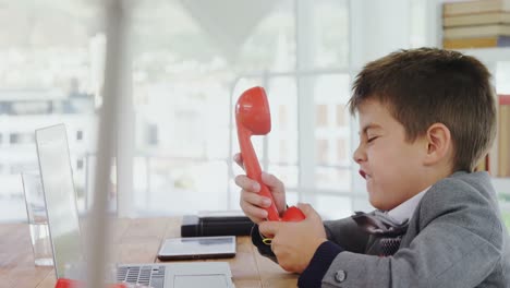 Boy-as-business-executive-screaming-on-phone-4k