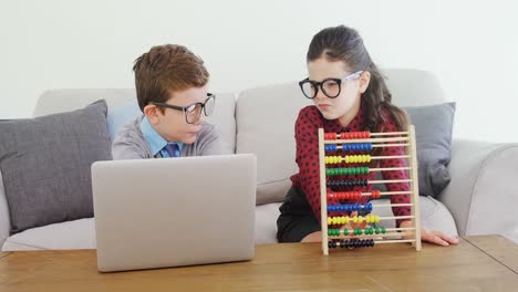 Kids-as-business-executive-disusing-over-laptop-4k