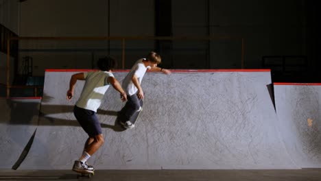 Male-friends-practicing-skateboarding-4k