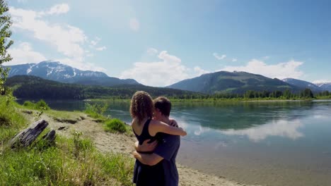 Couple-hugging-near-lakeside-4k