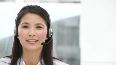 Asian-customer-agent-with-headset-on