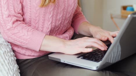 Woman-using-laptop-4k