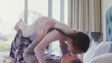 Father-lifting-up-her-daughter-4k