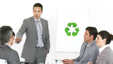 Confident-businessman-presenting-the-concept-of-recycling