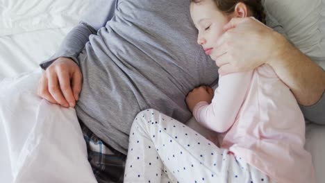 Father-and-daughter-peacefully-sleeping-together-4k