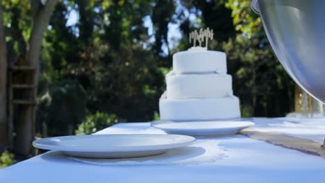White-wedding-cake-along-with-plates-4K-4k
