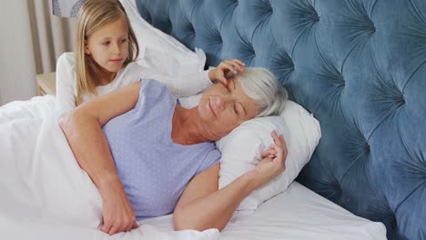 Granddaughter-waking-up-her-grandmother-4k