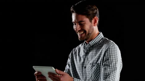 Smiling-man-using-digital-tablet-4k