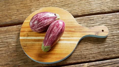 Two-eggplant-on-chopping-board-4k