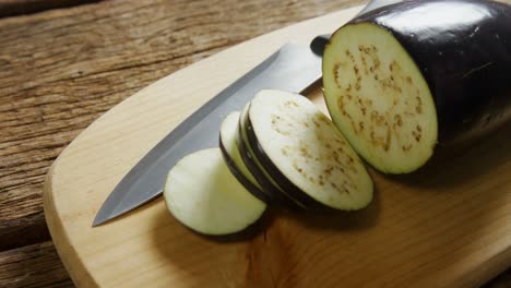 Sliced-eggplant-with-knife-on-chopping-board-4k