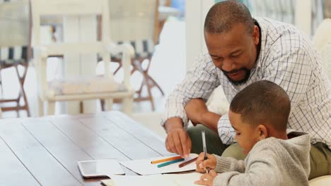 Father-helping-his-son-with-his-homework-4k