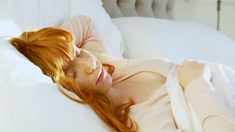 Beautiful-woman-sleeping-peacefully-on-bed-4k