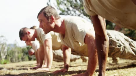 Military-soldiers-dosing-push-ups-during-obstacle-course-4k