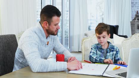 Father-helping-his-son-with-homework-4k