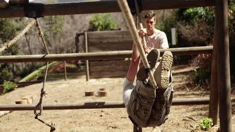 Military-soldier-crossing-the-rope-during-obstacle-course-4k