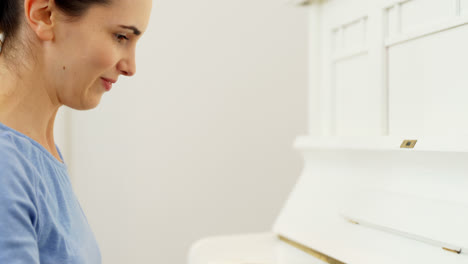 Woman-playing-piano-at-home-4k