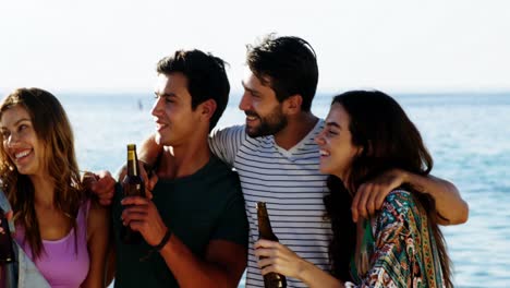 Friends-drinking-alcohol-on-the-beach-4k