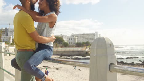 Couple-embracing-each-other-at-beach-4k