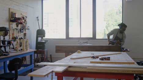 Carpenter-leveling-wood-with-polishing-machine-4k
