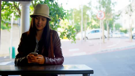 Woman-using-mobile-phone-near-city-street-4k