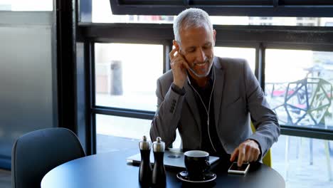 Businessman-talking-on-mobile-phone-in-hotel-4k