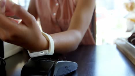 Teenage-girl-making-payment-through-smartwatch-4k