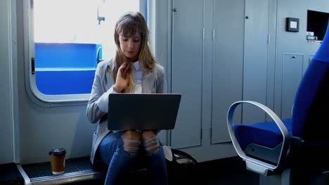 Woman-using-laptop-while-travelling-in-ferry-4k