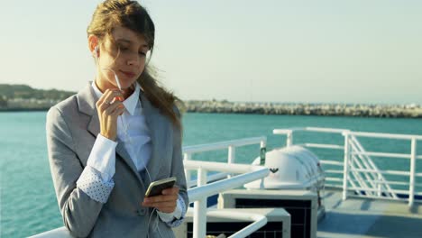 Woman-talking-on-mobile-phone-while-travelling-in-ferry-4k