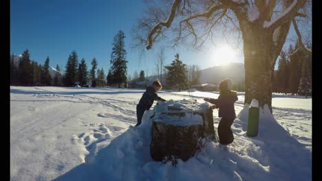 Kids-playing-in-the-snow-during-winter-4k