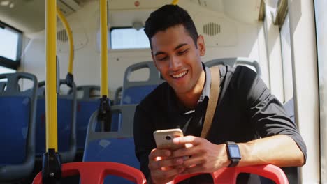 Male-commuter-using-mobile-phone-while-travelling-in-bus-4k