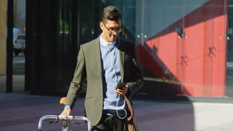 Man-using-mobile-phone-while-walking-on-street-4k