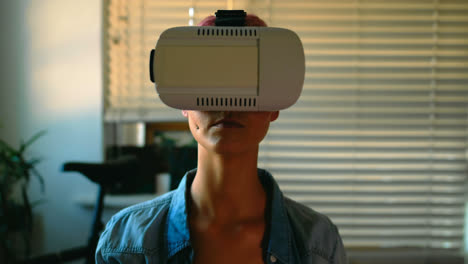 Woman-using-virtual-reality-headset-at-home-4k