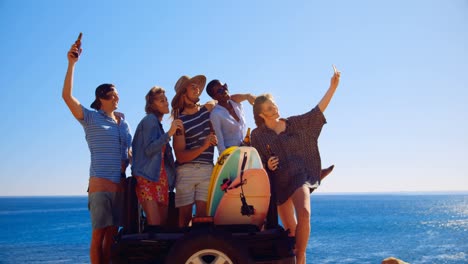 Group-of-friends-taking-selfie-with-mobile-phone-4k