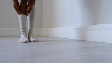Woman-wearing-socks-in-fitness-studio-4k