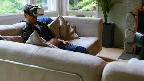 Father-and-son-using-virtual-reality-headset-in-living-room-4k