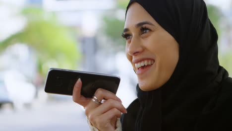 Woman-in-hijab-talking-on-the-phone-4k