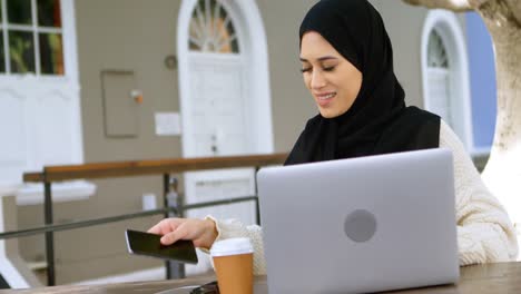 Beautiful-woman-in-hijab-talking-on-mobile-phone-4k