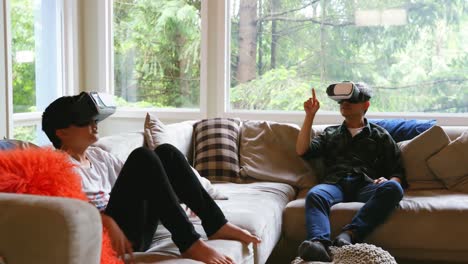 Father-and-son-using-virtual-reality-headset-in-living-room-4k