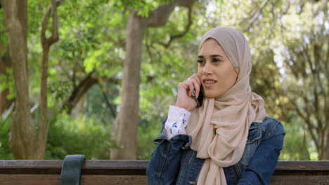 Woman-in-hijab-talking-on-mobile-phone-4k