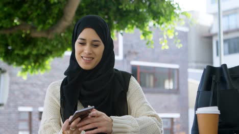 Woman-in-hijab-taking-selfie-with-mobile-phone-4k