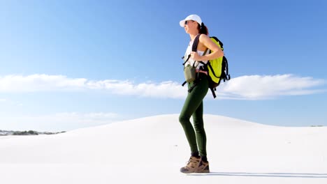 Woman-with-backpack-walking-in-the-desert-4k