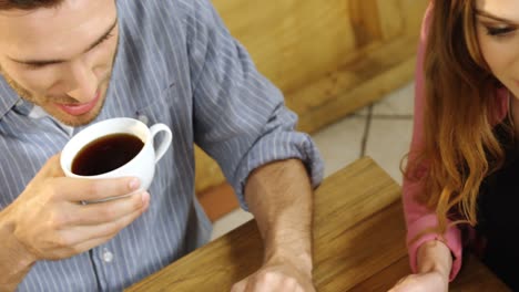 Couple-having-black-coffee-in-cafe-4k