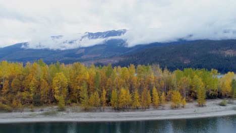 Autumn-forest-and-mountain-ranges-along-the-lake-4k