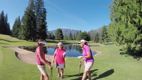Women-with-golf-club-talking-in-the-golf-course-4k
