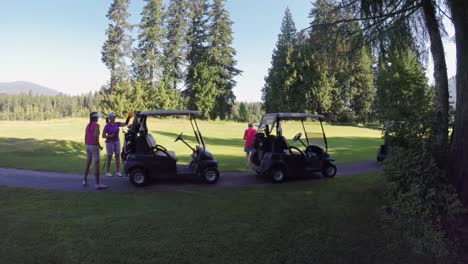 Women-getting-out-of-the-golf-cart-with-their-golf-club-4k