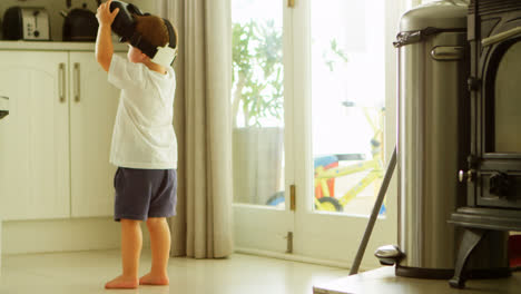 Boy-using-virtual-reality-headset-in-kitchen-4k