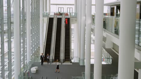 Business-people-using-escalator-4k
