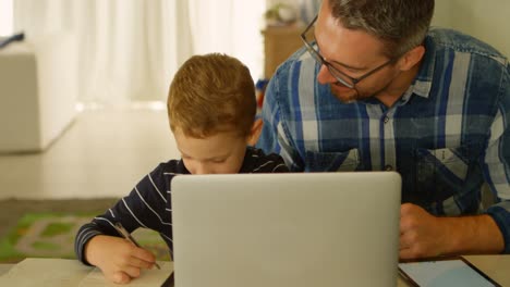 Father-helping-son-with-his-homework-4k