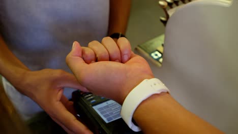 Customer-making-payment-through-smartwatch-4k