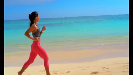 Woman-jogging-in-the-beach-4k